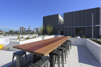 Rooftop farm table with electric plug-ins